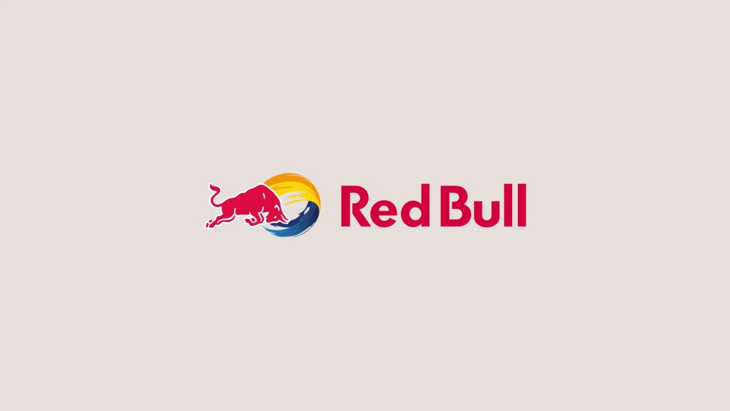 The slide features the Red Bull logo, showcasing a red bull leaping in front of a yellow and blue sun-like circular design. The text 