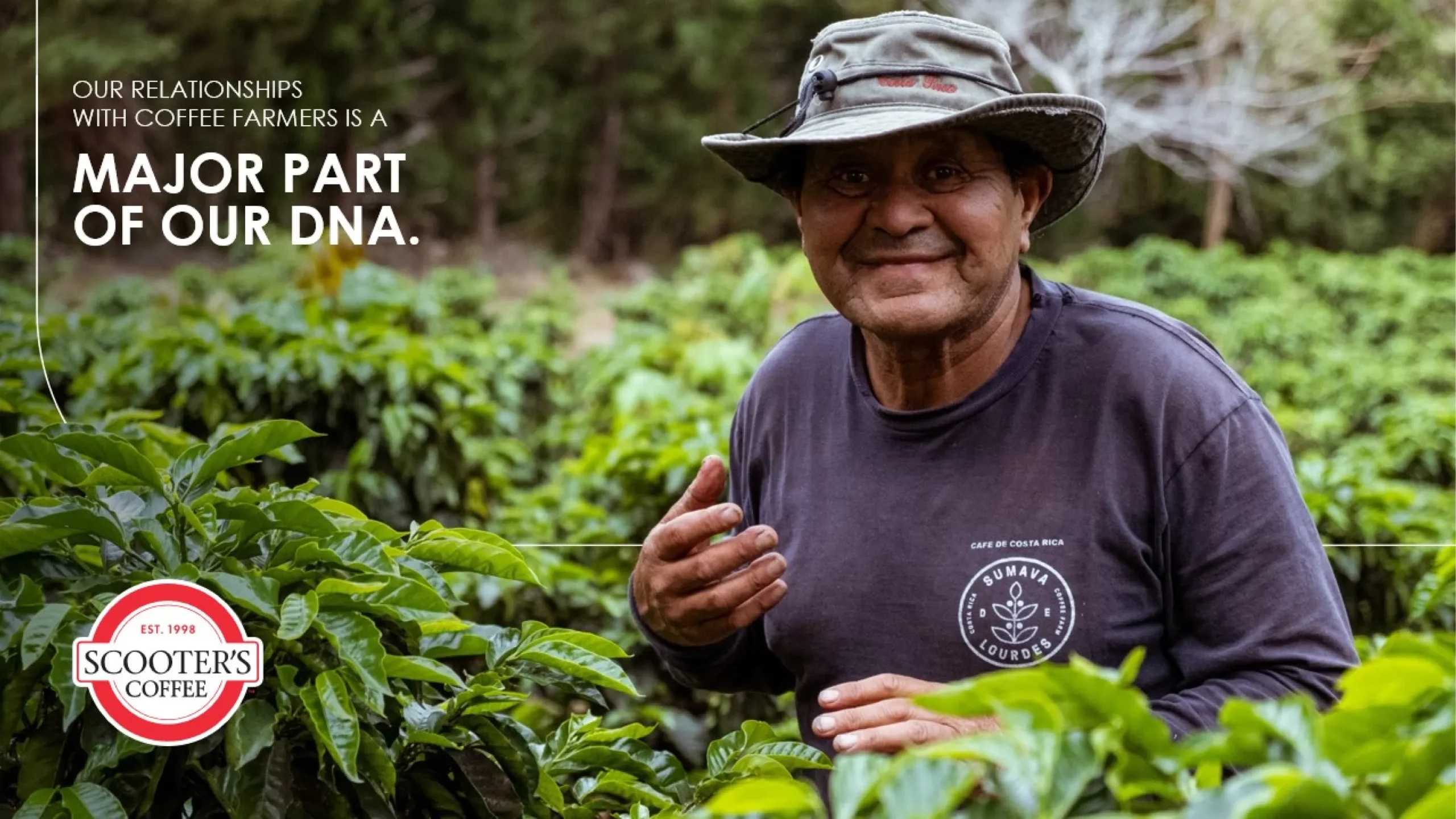 A smiling person in a hat and long-sleeve shirt stands amidst lush green coffee plants. Text reads, 