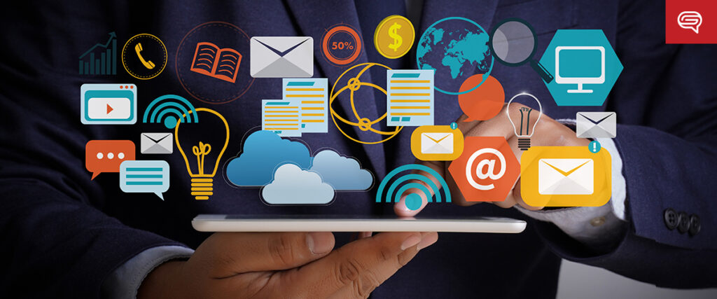A person holds a tablet surrounded by colorful digital icons, including a globe, email, cloud, light bulb, and shopping cart, symbolizing technology and communication through interactive microapps. A blurred dark background enhances the vibrant graphic elements.