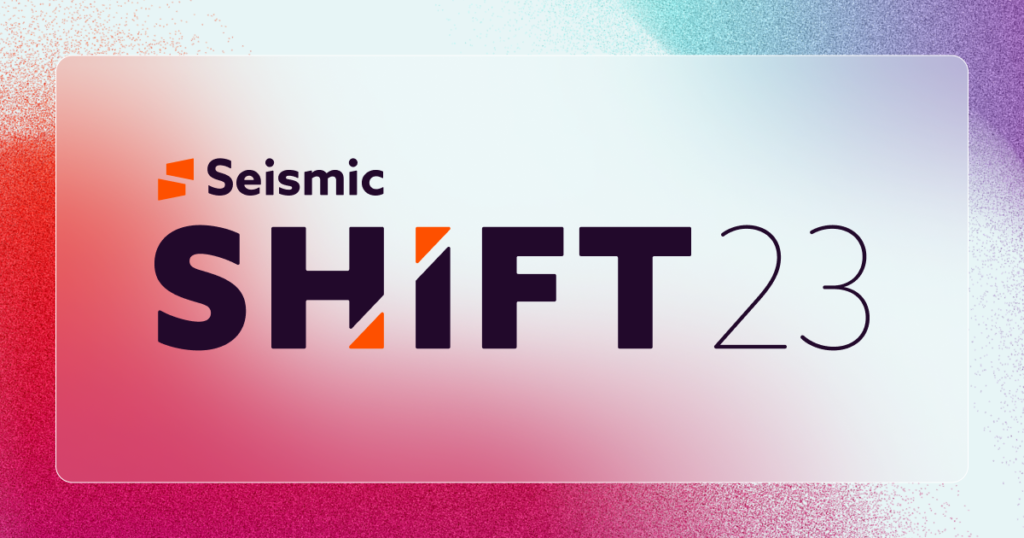 A vibrant graphic with a gradient background in pink, purple, and blue hues. The text "Seismic SHIFT 23" is boldly displayed, with "SHIFT" in larger font and an orange triangle accent within the "H," creating a design that feels like an auto draft of creativity.