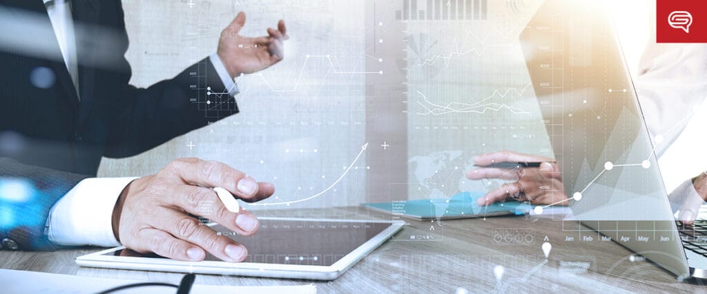 Two people in business attire are engaged in a discussion at a table with a tablet and a laptop. Transparent graphics of charts and statistics overlay the image, illustrating data analysis and business strategy concepts, as they prepare for seed funding round presentations.